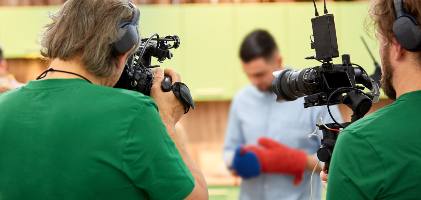 Behind the scenes of filming films or video products and the film crew of the film crew on the set in the pavilion of the film studio.