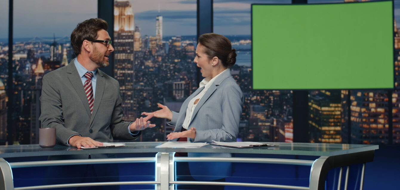 Charismatic tv hosts discussing mockup news evening closeup. Reporters talking