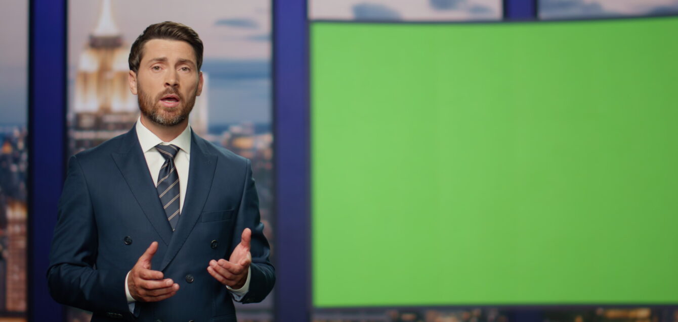 Elegant host reporting breaking news standing near green screen close up.