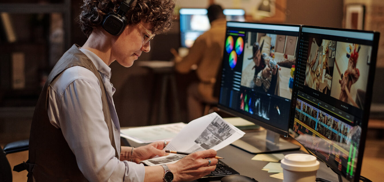 Footage editor examining script at workplace