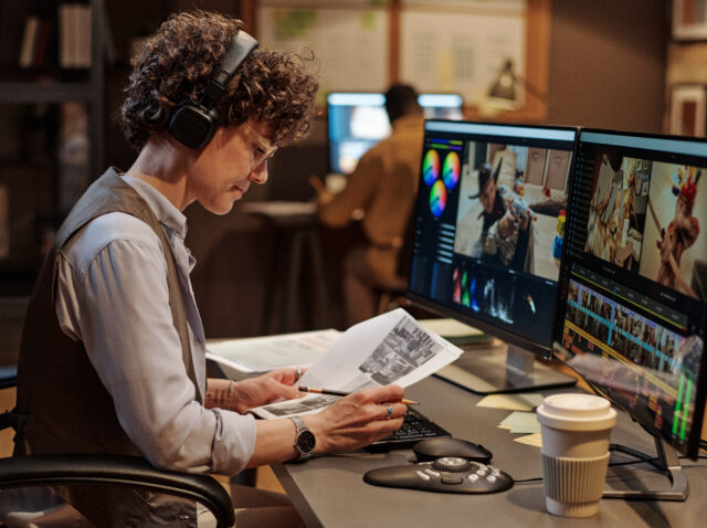 Footage editor examining script at workplace